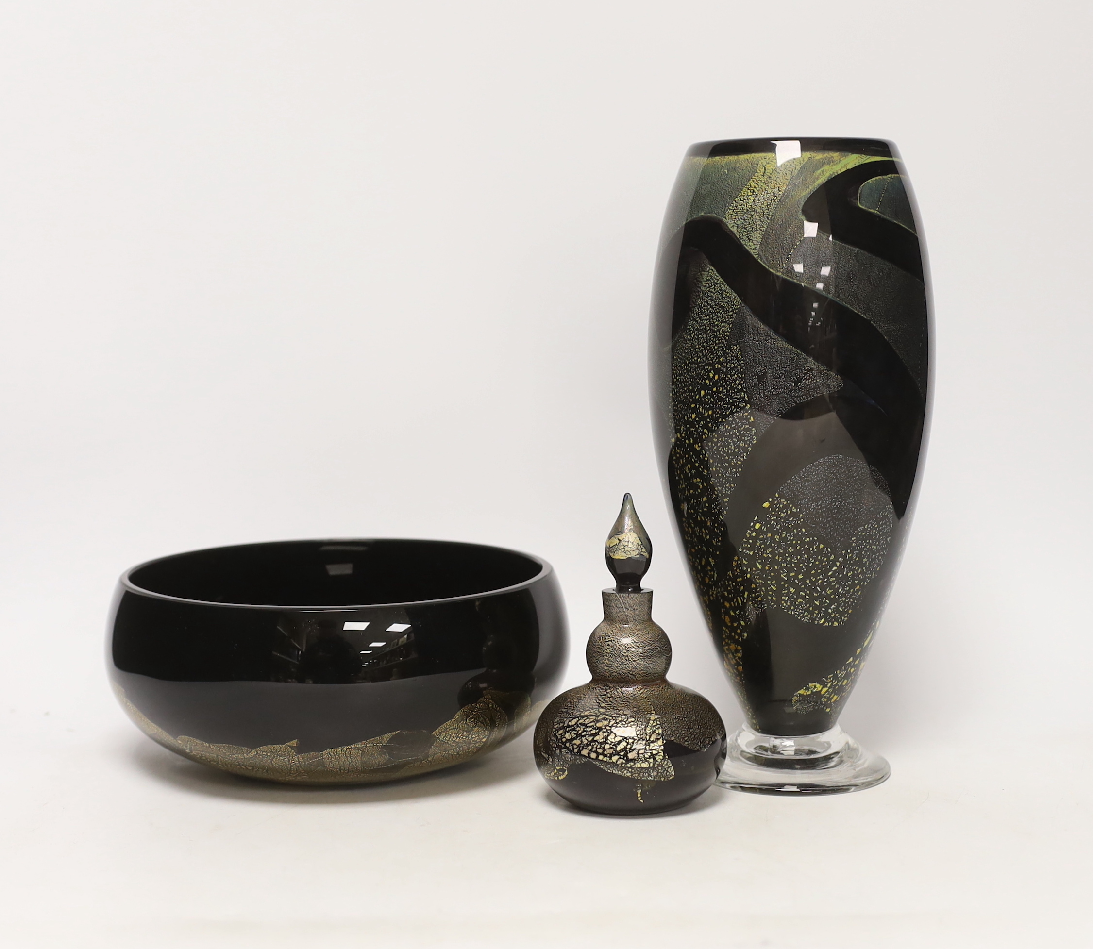 Three Isle of Wight glass pieces with gold flecked design, comprising vase, centre bowl and scent bottle with stopper, largest 27cm high
